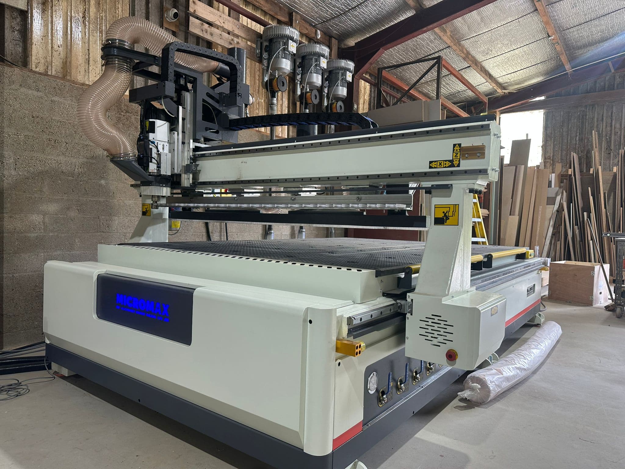Newly installed Micromax 2030 L ATC Newly installed Micromax 2030 L ATC CNC router with protective wrapping still on nearby components